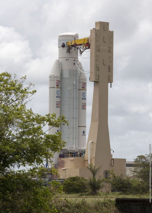 Lacking its payload fairing, the VA-218 stack is transferred from the Launcher Integration Building (BIL) to the Final Assembly Building (BAF) for payload installation operations. Photo Credit: Arianespace