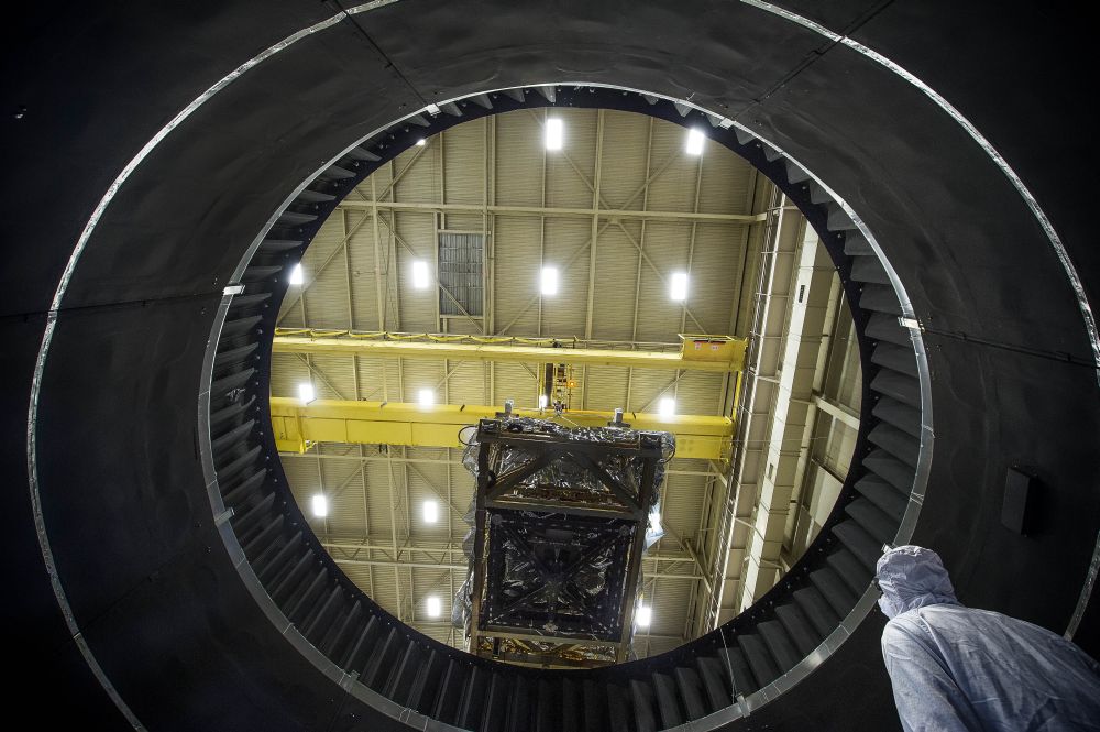 From NASA: "The view from inside NASA Goddard's Thermal Vacuum Chamber shows the JWST heart being lowered by crane in preparation of weeks of space environment testing." An essential component of the James Webb Space Telescope has just completed vacuum testing in extremely cold conditions. Photo Credit: NASA/Chris Gunn