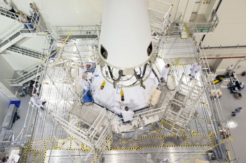 Technicians install the Launch Abort System (LAS) on top of Orion's capsule in preparations for December's flight test. Photo Credit: NASA