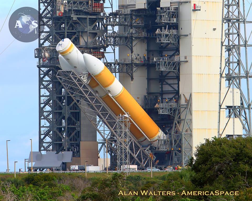 The United Launch Alliance Delta-IV Heavy tasked with launching NASA's Orion on the EFT-1 mission being hoisted vertical atop Space Launch Complex-37B this morning at Cape Canaveral Air Force Station in Florida this morning (Oct. 1, 2014). Photo Credit: Alan Walters / AmericaSpace