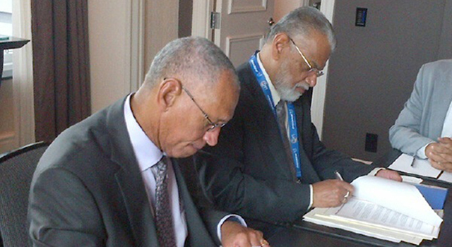 NASA Administrator Charles Bolden (left) and Chairman K. Radhakrishnan of the Indian Space Research Organisation signing documents in Toronto on Sept. 30, 2014 to launch a joint Earth-observing satellite mission and establish a pathway for future joint missions to explore Mars. Image and Caption Credit: NASA