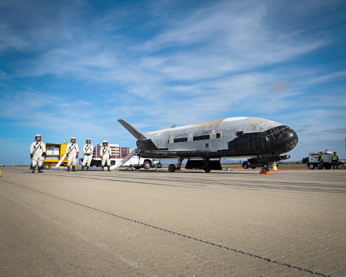 Recovery crew members process the X-37B Orbital Test Vehicle at Vandenberg Air Force Base after completing 674 days in space. A total of three X-37B missions have been completed, totaling 1,367 days on orbit. The X-37B will be equipped with a NASA materials exposure experiment with nearly 100 samples focusing on polymers, composites and specialized coatings when it launches for the fourth time on May 20. Photo Credit: Boeing