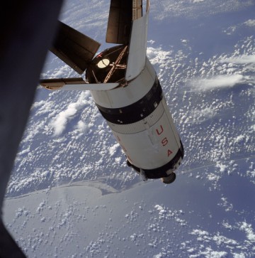 From NASA: "The expended Saturn S-IVB stage as photographed from the Apollo 7 spacecraft during transposition and docking maneuvers at an approximate altitude of 125 nautical miles, at ground elapsed time of three hours and 16 minutes (beginning of third revolution). This view is over the Atlantic Ocean off the coast of Cape Kennedy, Florida." Photo Credit: NASA