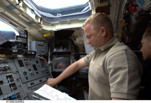 Boe and Chris Ferguson (partially obscured at right) work on Endeavour's aft flight deck during the STS-126 mission in November 2008. Photo Credit: NASA