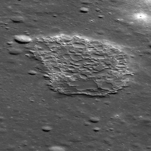 A close-up oblique view of Ina, as seen by the Lunar Reconnaissance Orbiter, showcasing the contrast between its smooth and rough terrain. The floor of the depression is about 50 m below the surrounding plains and is about 2 km wide. Image Credit: NASA/GSFC/Arizona State University