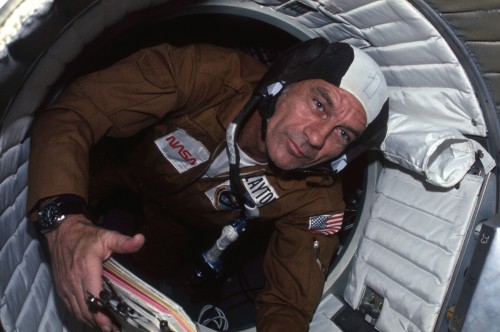 Savoring his first experience of weightlessness, Deke Slayton traverses through the Docking Module during his one and only space mission. Photo Credit: NASA