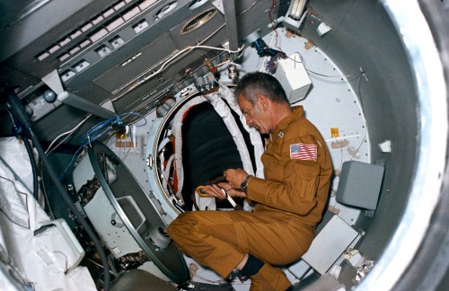 Deke Slayton works inside a mockup of the Apollo Docking Module (DM) in September 1974. Photo Credit: NASA