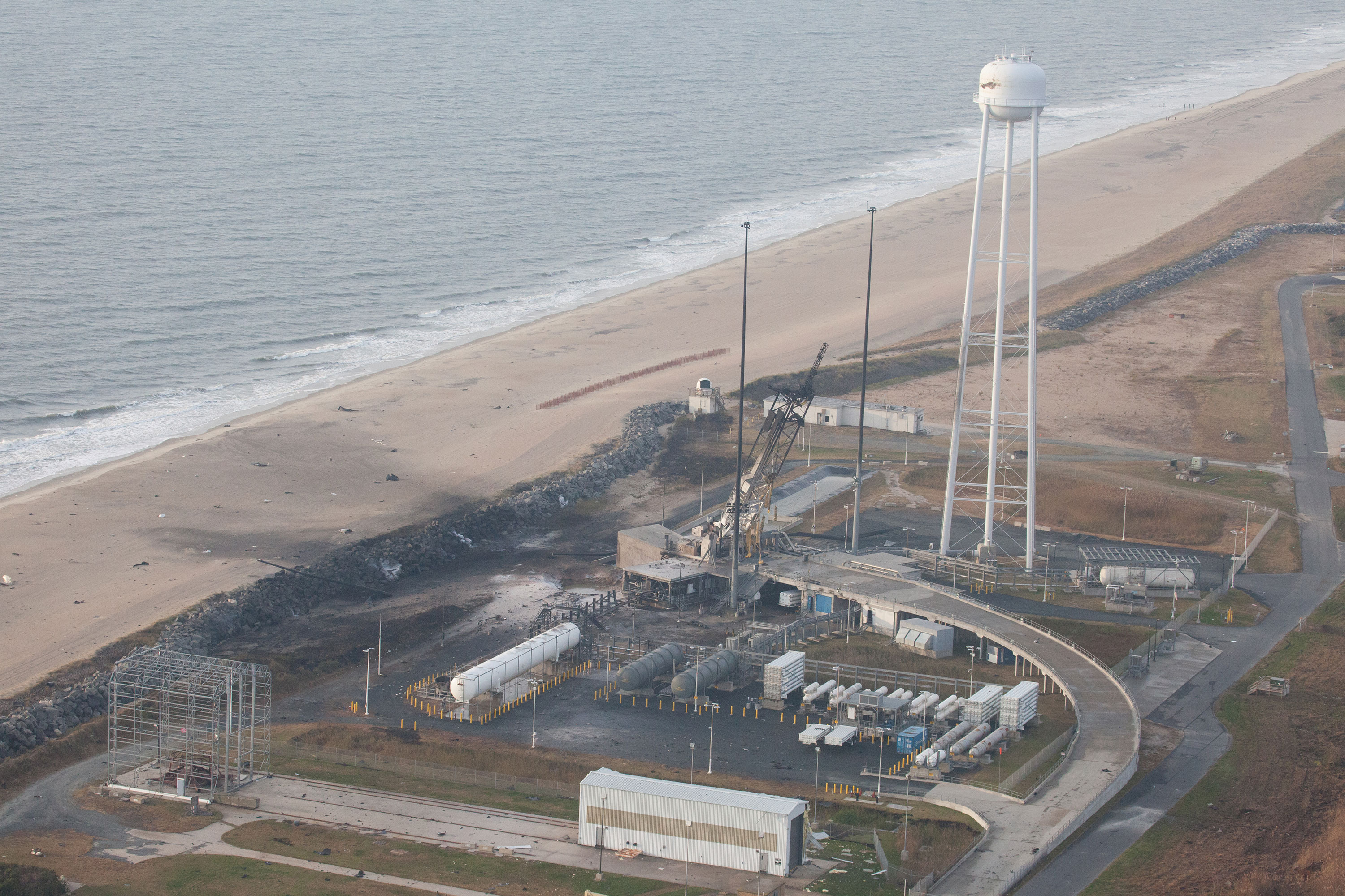 An aerial view of the Wallops Island launch facilities taken by the Wallops Incident Response Team Oct. 29 following the failed launch attempt of Orbital Science Corp.'s Antares rocket Oct. 28.  Image Credit: NASA/Terry Zaperach 