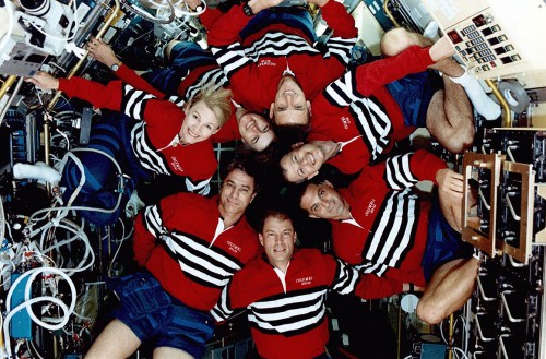 The STS-58 crew gathers for an informal portrait inside the Spacelab module. Photo Credit: NASA