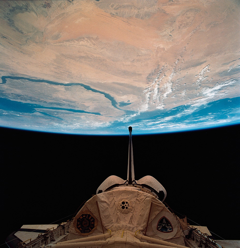 Glorious view of the Home Planet from STS-58, with the SLS-2 Spacelab module clearly visible in Columbia's payload bay. Photo Credit: NASA