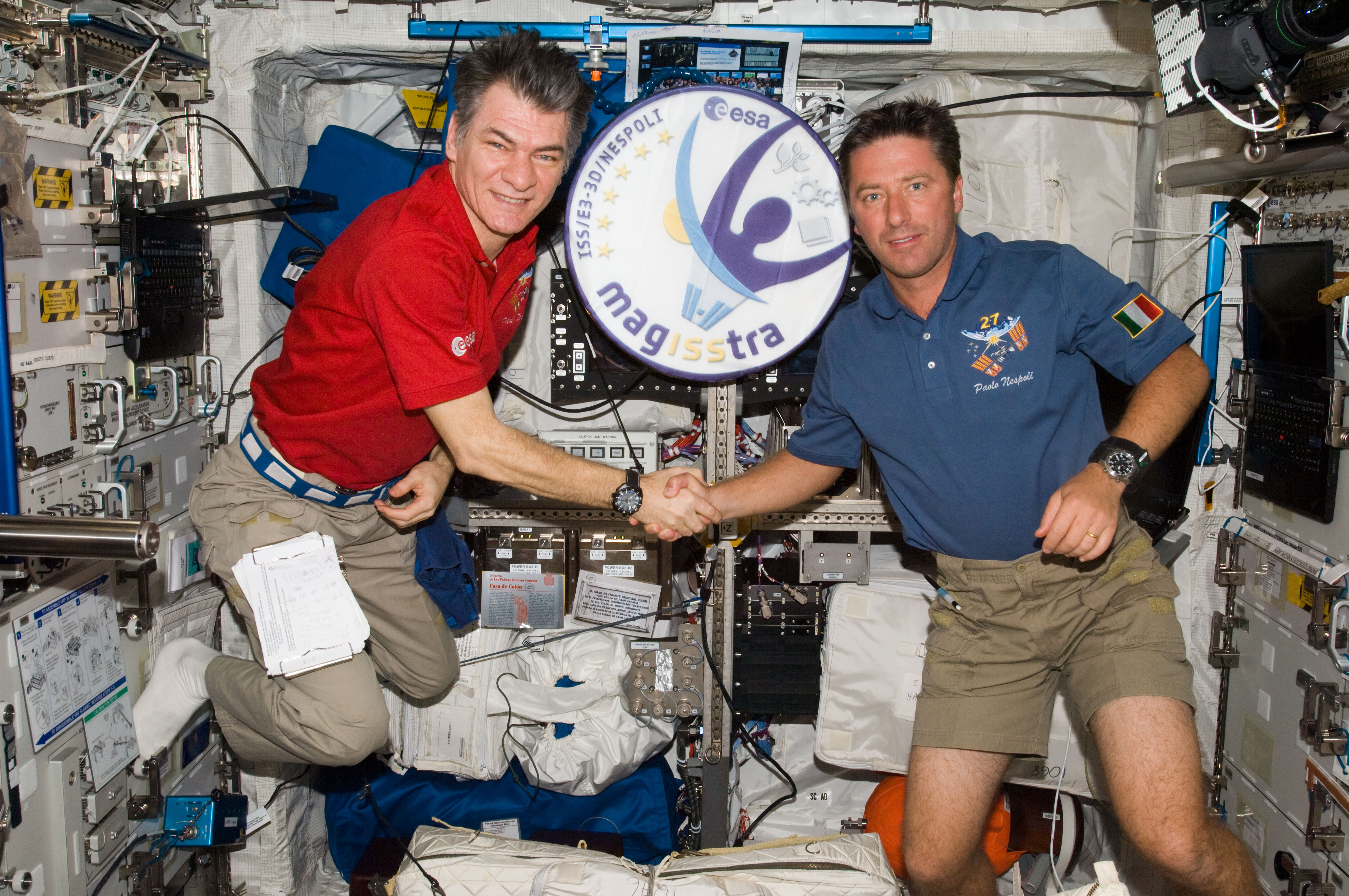 Roberto Vittori (right), who turns 50 today, is pictured with fellow Italian astronaut Paolo Nespoli in Europe's Columbus laboratory, aboard the International Space Station (ISS) in May 2011. Photo Credit: NASA