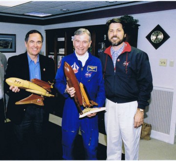 Phillips' has presented his handcrafted shuttle models to crews, including STS-1. From left, STS-1 pilot Bob Crippen, commander John W. Young, and Phillips. Photo Credit: Scott G. Phillips