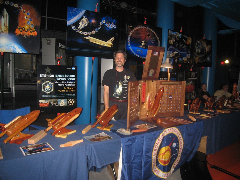 Scott G. Phillips stands by his space shuttle tribute display. Phillips' new memoir, Remove Before Flight, tells the story of his own personal shuttle odyssey. Photo Credit: Scott G. Phillips
