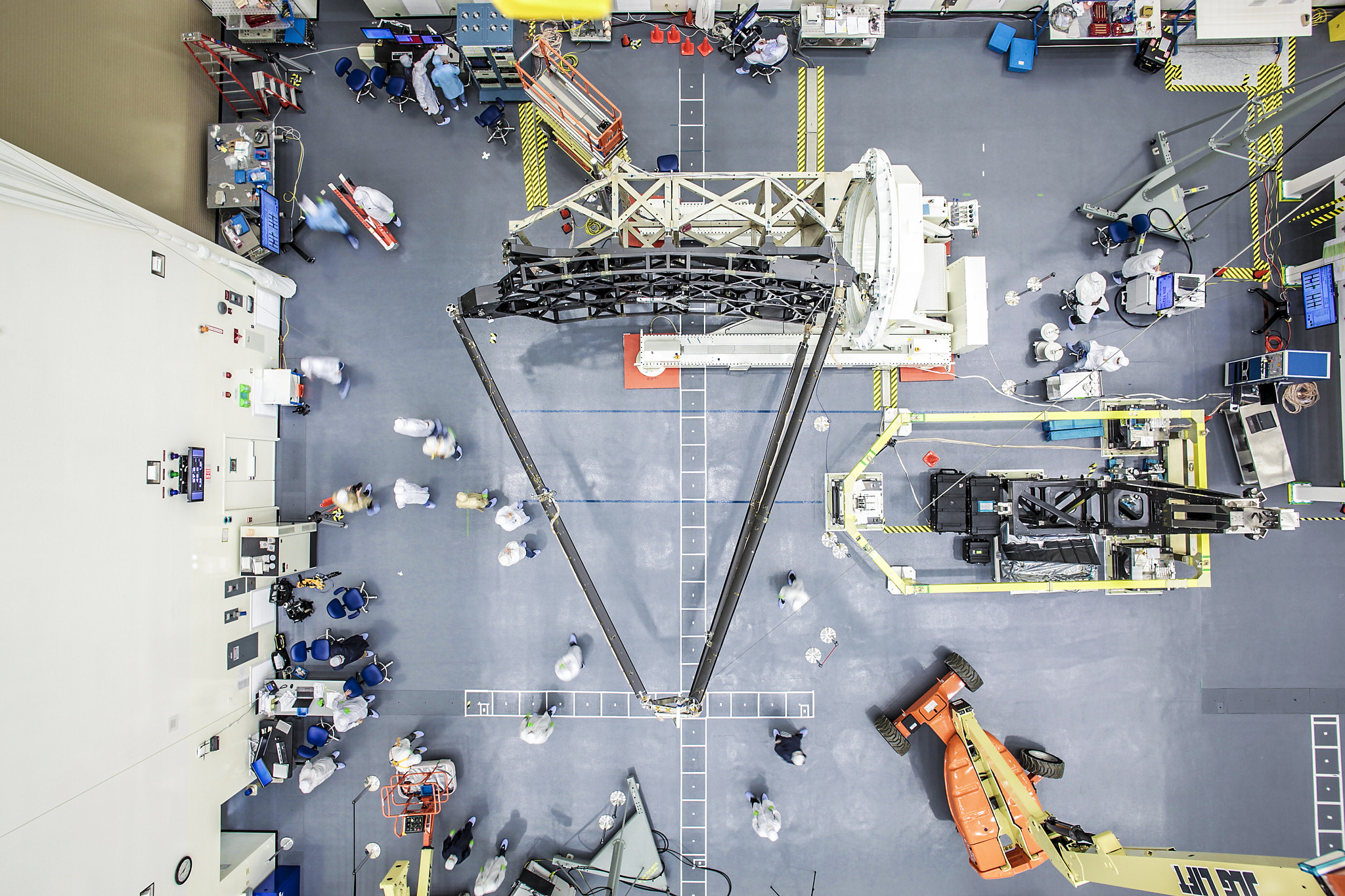 Top-down view of the James Webb Space Telescope pathfinder backplane with the secondary mirror booms or "tripod" fully extended in a cleanroom at Northrop Grumman.  Credit:  Northrop Grumman/Alex Evers