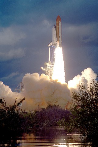 Discovery thunders into orbit on 8 November 1984 to begin the first shuttle mission to deploy and retrieve two pairs of spacecraft. Photo Credit: NASA
