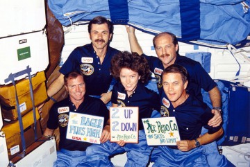The STS-51A crew celebrates their success, after deploying two satellites and retrieving two others. Photo Credit: NASA