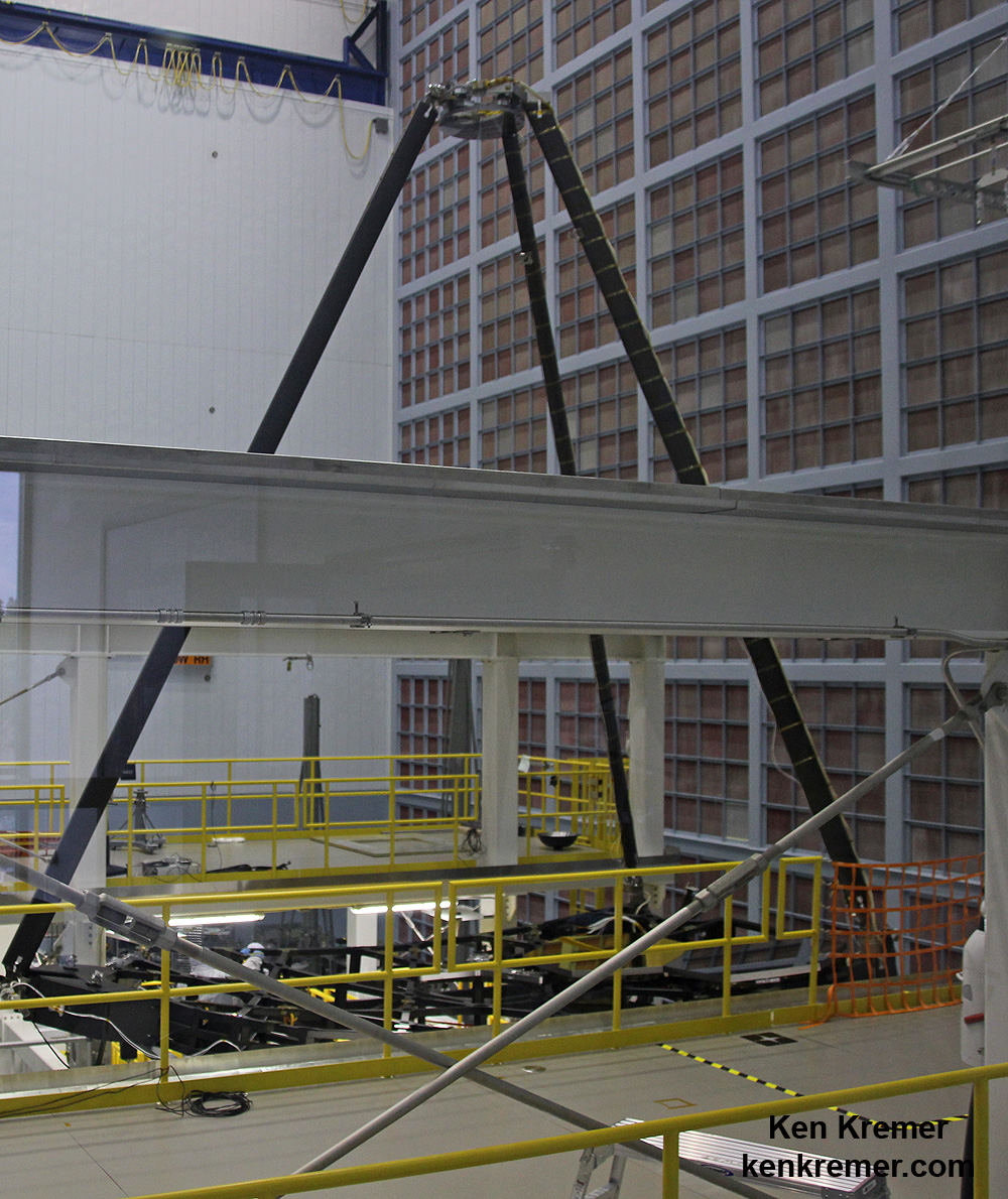 JWST’s mammoth tripod assembly has been attached to the "Pathfinder" backplane holding the telescopes primary mirrors during recent testing and processing inside the clean room at NASA Goddard Space Flight Center, Greenbelt, Md.  Secondary mirror at top.  Credit: Ken Kremer- kenkremer.com