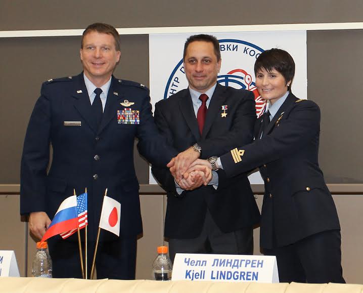 At the Gagarin Cosmonaut Training Center in Star City, Russia, Expedition 42/43 prime crew members Terry Virts of NASA (left), Anton Shkaplerov of the Russian Federal Space Agency (Roscosmos, center) and Samantha Cristoforetti of the European Space Agency (right) pose for pictures following a news conference Nov. 6. Virts, Cristoforetti and Shkaplerov will launch Nov. 24, Kazakh time from the Baikonur Cosmodrome in Kazakhstan on their Soyuz TMA-15M spacecraft for a 5 ½ month mission on the International Space Station. Photo Credit: NASA/Stephanie Stoll​