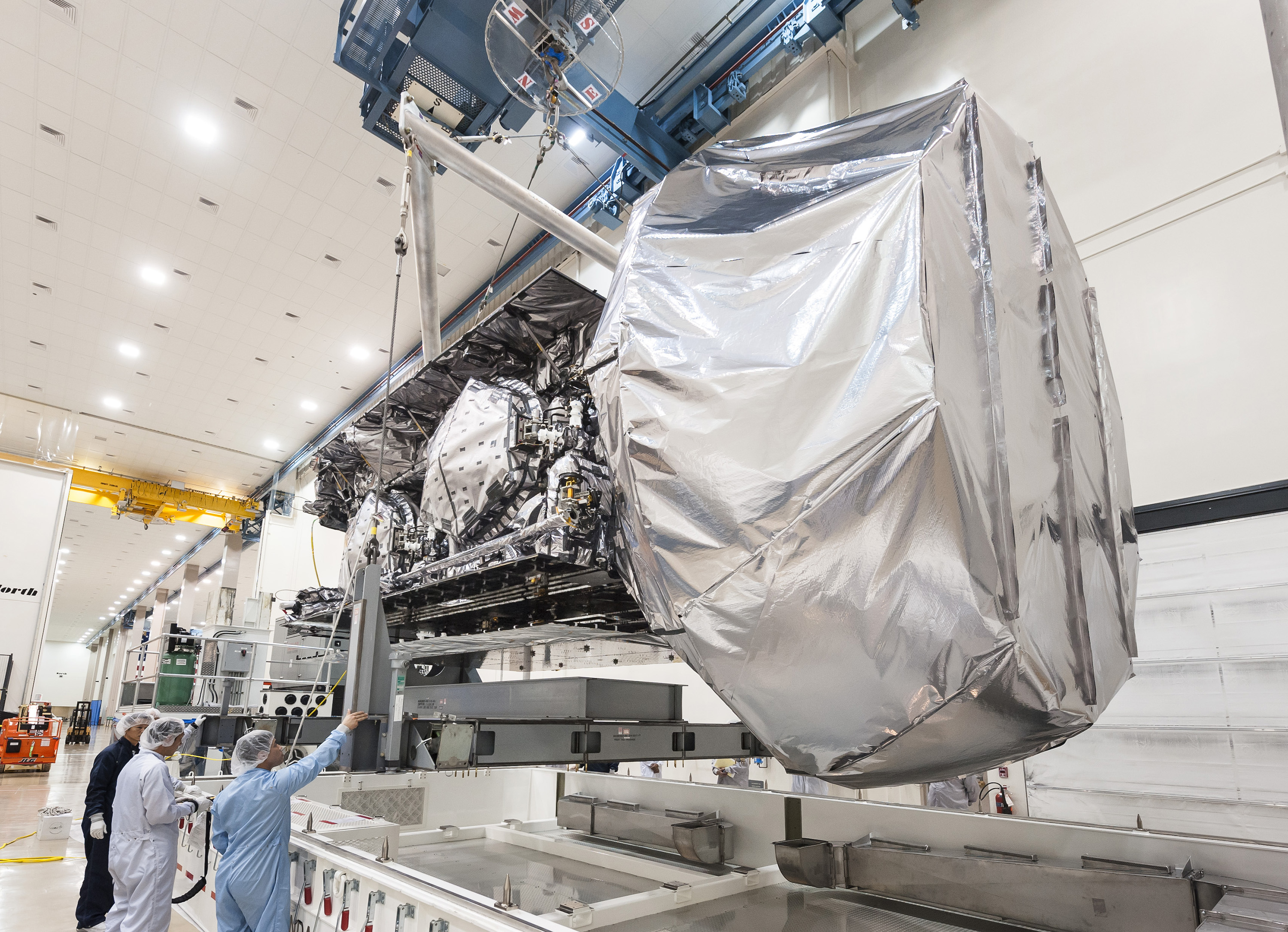 Crews with Lockheed Martin lifting the NAVY's MUOS-3 satellite for placement in its shipping container fpr delivery to Cape Canaveral, Fla., ahead of a planned January 2015 launch. Photo Credit: Lockheed Martin