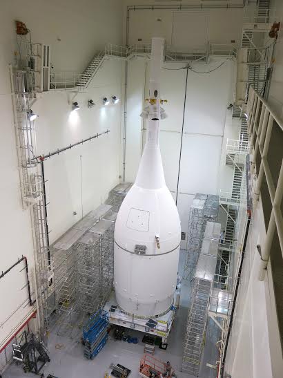 NASA's Orion spacecraft is seen here, complete, inside the Launch Abort System Facility at NASA's Kennedy Space Center in Fla. on Oct. 30, 2014. The spacecraft is scheduled to roll out to nearby Space Launch Complex 37 at Cape Canaveral Air Force Station to meet its rocket for a scheduled Dec. 4 launch on Exploration Flight Test 1 (EFT-1). Photo Credit: Lockheed Martin