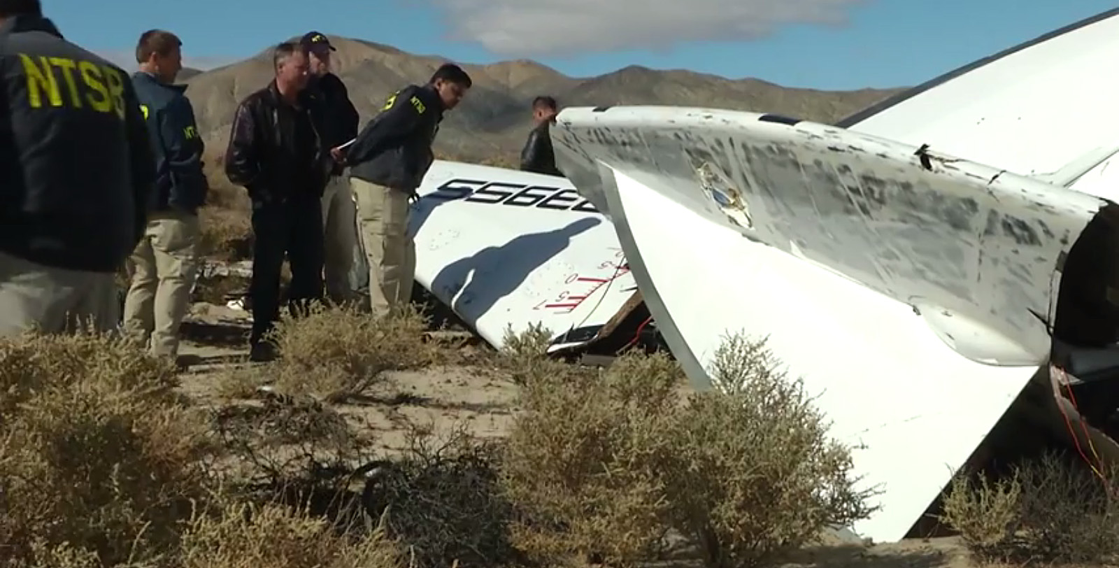 Investigators with the National Transportation Safety Board (NTSB) looking over wreckage from the crash of Virgin Galactic's Spaceship Two, which killed co-pilot Michael Alsbury and injured co-pilot Peter Siebold, who managed to parachute to the ground. Photo Credit: NTSB