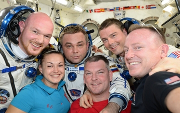 Shortly before their departure, Soyuz TMA-13M crewmen Alexander Gerst, Max Surayev and Reid Wiseman, clad in their Sokol ("Falcon") launch and entry suits, shared a selfie with the "core" Expedition 42 crew of Yelena Serova, Aleksandr Samokutyayev and Barry "Butch" Wilmore. Photo Credit: NASA