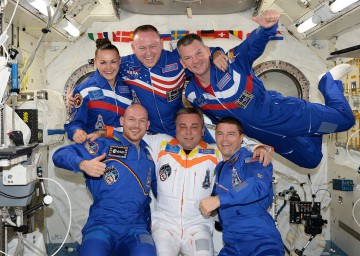 The Expedition 41 crew gather inside Japan's Kibo laboratory for a group portrait. Front row (from left) are Alexander Gerst, Max Surayev and Reid Wiseman, and back row (from left) are Yelena Serova, Barry "Butch" Wilmore and Aleksandr Samokutyayev. Photo Credit: NASA