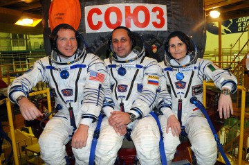 Virts, Shkaplerov and Cristoforetti pose in front of their Soyuz TMA-15M descent module, following suited fit-checks at Baikonur in November 2014. Photo Credit: NASA