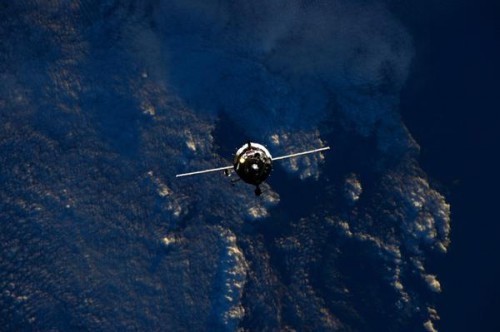 Backdropped by the stunning deep blue ocean trenches of Earth, Soyuz TMA-15M approaches its home in space for the next six months. Photo Credit: NASA