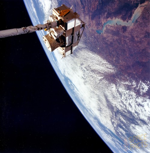 Grappled by the shuttle's RMS arm, the CRISTA-SPAS satellite spent more than a week conducting observations of Earth's atmosphere. Photo Credit: NASA