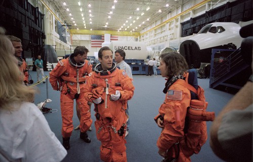 Clad in their pumpkin-orange launch and entry suits, four members of STS-66 are pictured during training in 1994. From left are Scott Parazynski (slightly obscured), Joe Tanner, France's Jean-Francois Clervoy and Ellen Ochoa. Photo Credit: NASA