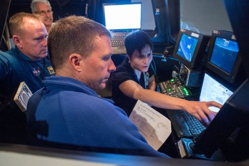 Expedition 42 crew members Barry "Butch" Wilmore, Terry Virts and Samantha Cristoforetti participate in a training exercise in a cupola simulator. This mirrors many of their activities during the CRS-5 rendezvous and berthing. Photo Credit: NASA