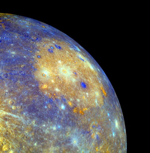 An enhanced color image of the 1,550 km-wide Caloris basin, which is the largest impact crater on Mercury. The craters on the floor of the basin show several different colors on their rims, indicating different depths of excavation, and some have been embayed, suggesting post-impact volcanic activity. Image Credit: Science/AAAS