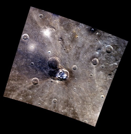 Overhead view of Balanchine crater. One possibility for its formation might be that it formed in part atop a similarly sized, preexisting impact crater. This older crater excavated the lower reflectance blue deposit from beneath the surface, part of which was then redistributed by the impact that formed Balanchine. 