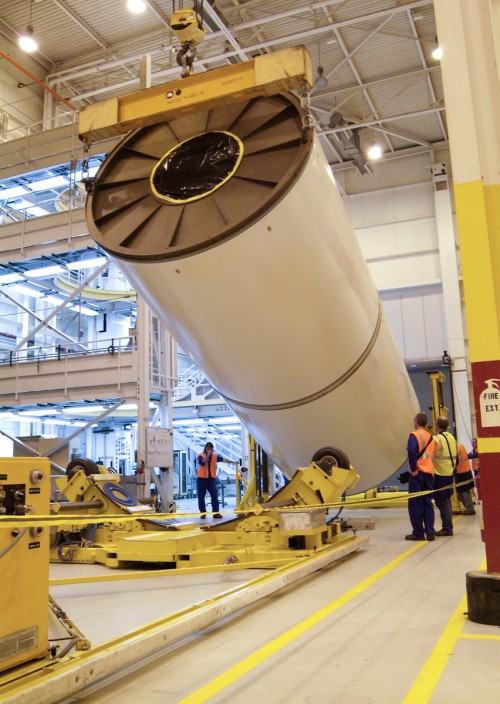 File photo of ATK technicians inspecting a segment of the five-segment SRB for NASA's future SLS rocket. Photo Credit: NASA/MSFC