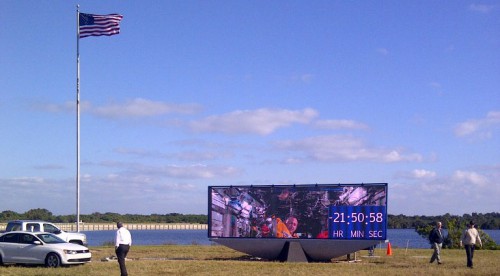 A new countdown display has been constructed in the place of the former analog countdown clock at the Press Site at NASA's Kennedy Space Center in Florida. The display is a modern, digital LED display akin to stadium monitors. It allows television images to be shown along with numbers. Photo Credit: NASA