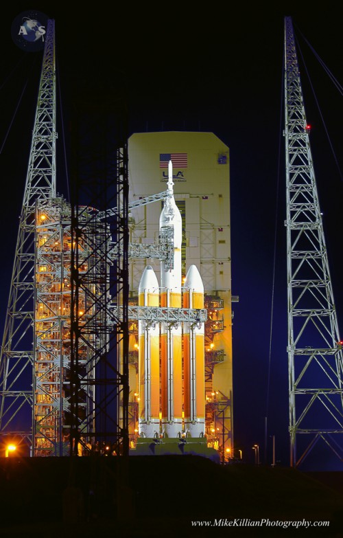 Orion, NASA's deep-space crew capsule, and its Delta-IV Heavy rocket bathed in xenon lights at launch pad 37B / Cape Canaveral Air Force Station, Fla the night before launching on its first test flight, EFT-1. Photo Credit: Mike Killian / AmericaSpace 