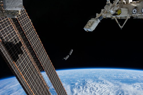 A set of NanoRacks CubeSats is photographed by an Expedition 38 crew member onboard the International Space Station after the deployment by the NanoRacks Launcher attached to the end of the Japanese robotic arm on February 2014. One of the many functions of the orbiting laboratory, is to be used as a CubeSat launch platform. Image Credit: NASA