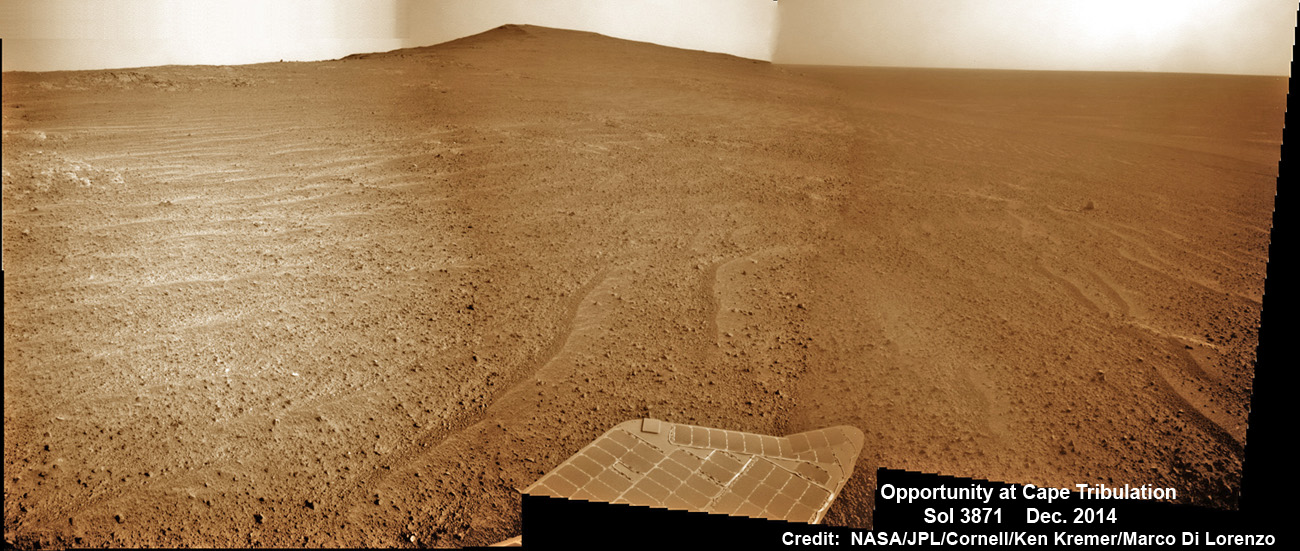 NASA’s Opportunity Mars rover scans to the summit of Cape Tribulation less than 100 meters distant in mid-December 2014. Beyond lie caches of clay minerals. The scene shows impact breccias and thin soil cover with cobbles over bedrock. This navcam camera photo mosaic was assembled from images taken on Sol 3871, Dec. 13, 2014 and colorized. Credit: NASA/JPL/Cornell/ Ken Kremer - kenkremer.com/ Marco Di Lorenzo