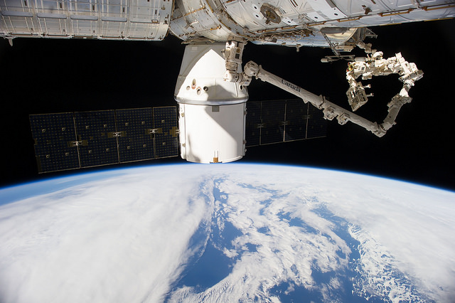 Spectacular view of the CRS-4 Dragon cargo ship, pictured berthed at the Earth-facing (or "nadir") port of the Harmony node in September 2014. Photo Credit: NASA