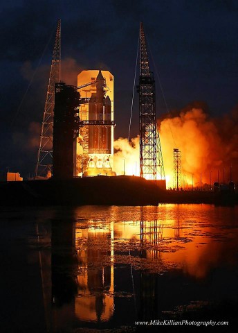 Like a beautiful painting, the plumes of the RS-68 main engines roar to life at 7:05 a.m. EST. Photo Credit: Mike Killian/AmericaSpace