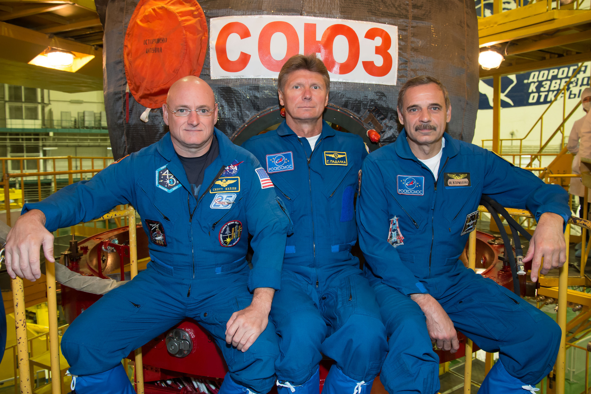 The Soyuz TMA-16M crew, scheduled to launch on 27 March 2015, includes Gennadi Padalka (center), who will become the world space endurance record-holder by the end of his six-month stay aboard the International Space Station (ISS). Flanking him are the two year-long crew members, Scott Kelly (left) and Mikhail Kornienko, who will catapult themselves into the Top Twenty most seasoned spacefarers of all time. Photo Credit: NASA