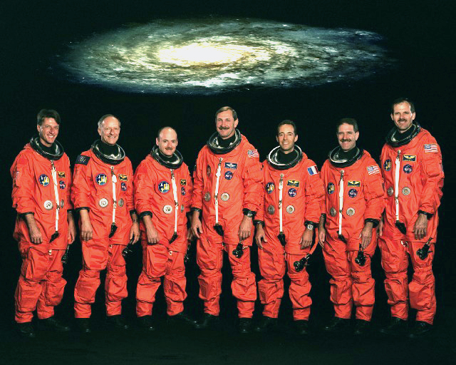 The seven STS-103 astronauts, when fully assembled, marked the most flight-experienced shuttle crew in the program's 30-year history. Between them, they had chalked up 18 flights when they walked to the pad on launch morning. Photo Credit: NASA