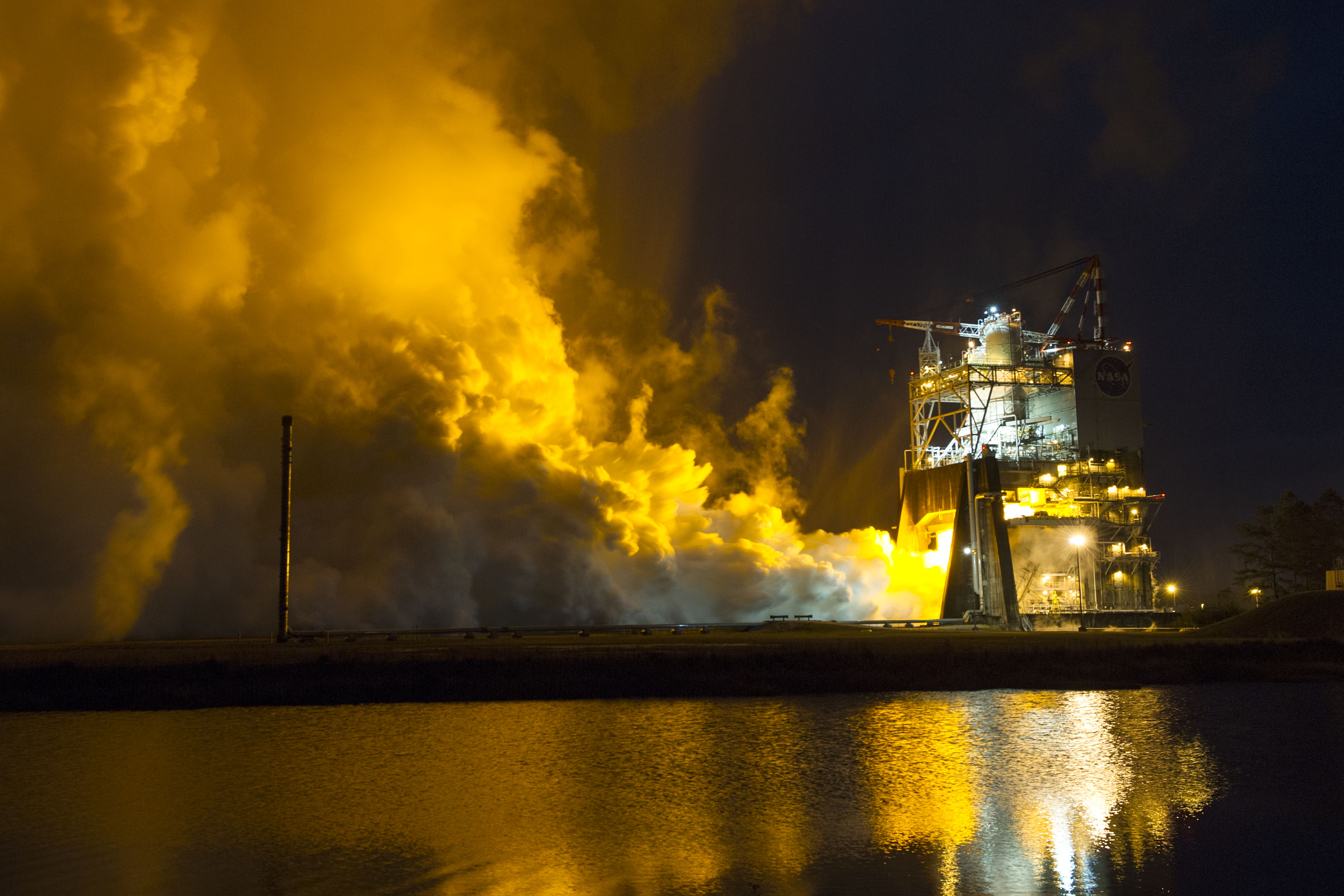 The first of eight tests for the SLS development engine, which will provide NASA engineers with critical data on the engine controller unit and inlet pressure conditions. Four RS-25 engines will power SLS on future missions, including to an asteroid and ultimately to Mars. Photo Credit: NASA