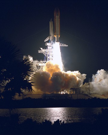 Discovery roars into the night on 3 February 1995. Photo Credit: NASA
