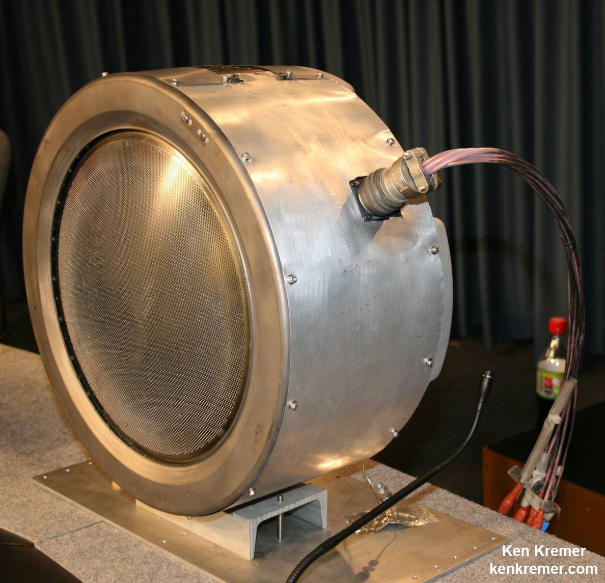 Dawn's ion thruster.  An engineering model of one of Dawn's three ion thrusters, which use electrical power to ionize xenon gas and accelerate it to a speed 10 times that of chemical engines. Each thruster is 30 centimeters (12 inches) in diameter and is steerable in two axes. Credit: Ken Kremer - kenkremer.com