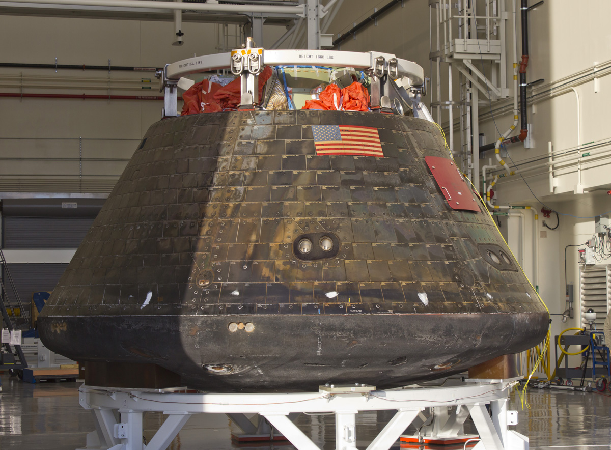 Orion EFT-1 capsule on display at the Launch Abost System facility at the Kennedy Space Center on Jan. 6, 2015 during inspection tour by NASA Administrator Charles Bolden following its launch and ocean recovery on Dec. 5, 2014.  Credit: Jeff Seibert/AmericaSpace 