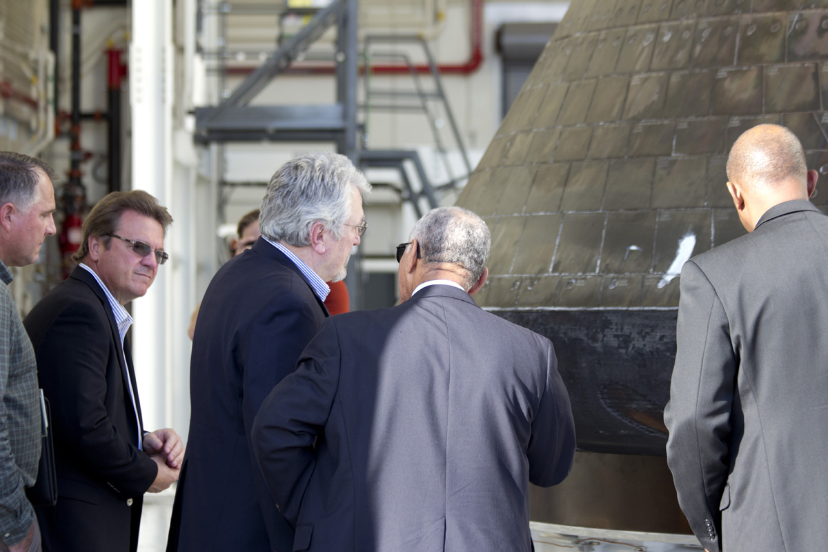 NASA Administrator Charles Bolden (center) visits the Orion EFT-1 capsule at the Kennedy Space Center on Jan. 6, 2015 for his first look at the capsule and how it fared since its first aunch and ocean recovery on Dec. 5, 2014. Credit: Jeff Seibert/AmericaSpace