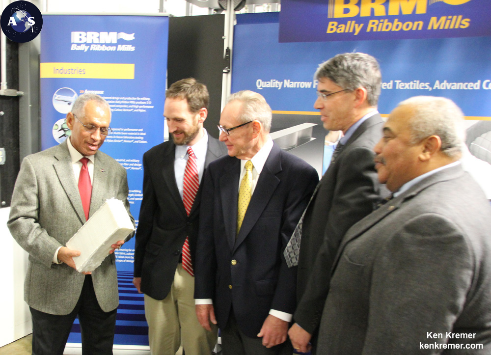 NASA Administrator Charles Bolden (left) holds Orion EM-1 3-D woven heat shield hardware produced by Bally Ribbon Mills of Bally, Penn. With Bolden are Mark Harries and Ray Harries, Marketing Executive and President of Bally Ribbon Mills, and Mike Gazarik (Associate Administrator STMD) and Glenn Delgado (Head small business) of NASA at media briefing in Bally, Pa., on Jan. 9, 2015. Credit: Ken Kremer/kenkremer.com/AmericaSpace