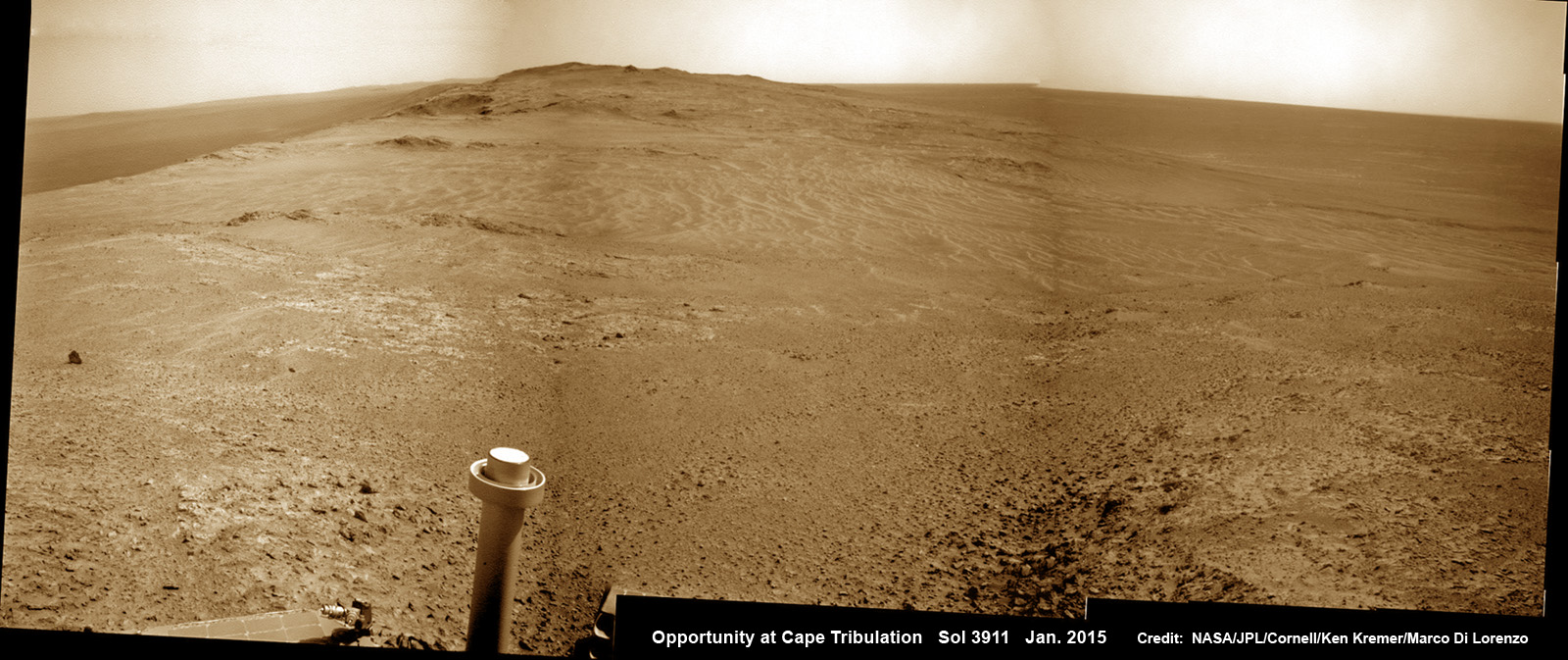 11 Years on Mars! New mountain top view from NASA’s Opportunity rover taken on the day of her 11th anniversary exploring the Red Planet on Sol 3911, Jan. 24, 2015 since Martian touchdown on Jan. 24, 2004. The view from atop Cape Tribulation was taken just after departing the summit and shows the down slope road ahead to next science destination at Marathon Valley some 200 meters away.  This navcam camera photo mosaic was assembled from images taken on Sol 3911 and colorized.  Credit: NASA/JPL/Cornell/ Ken Kremer/kenkremer.com/Marco Di Lorenzo